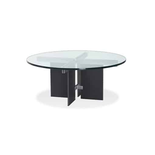 Coffee table with round glass top and four metal panel legs